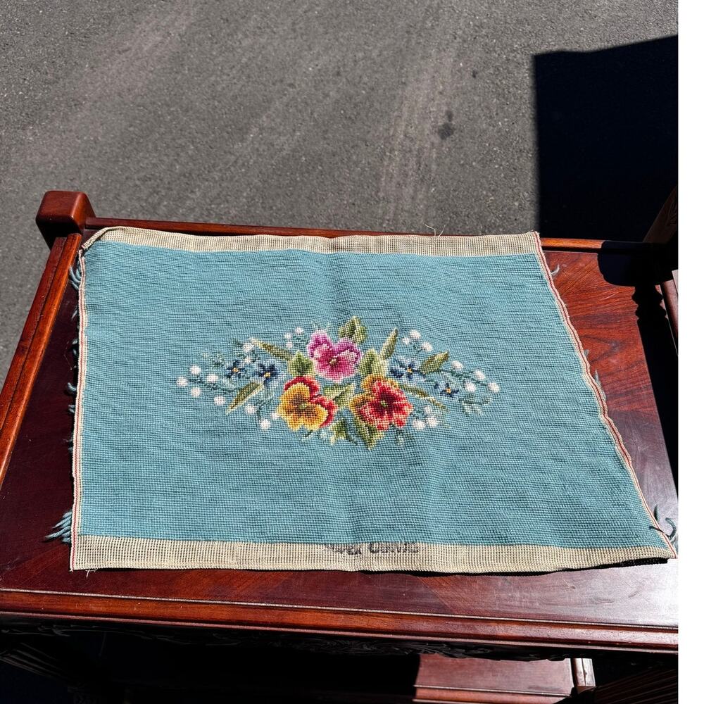 needlepoint canvas light blue background central cluster of flowers vintage